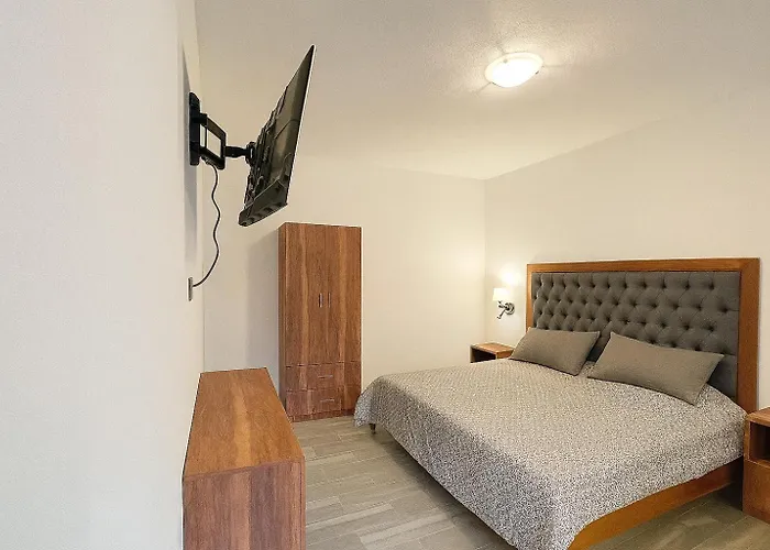 Apartahotel C O V A D O N G A